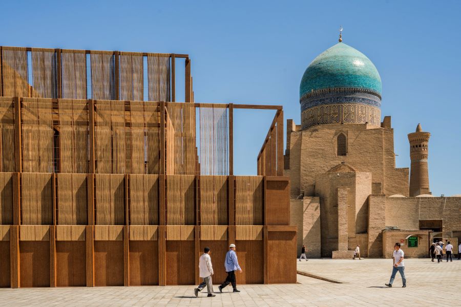 The AlMusalla pictured in situ in Bukhara, Uzbekistan with the distinctive blue of the Kalan Mosque in the background.
